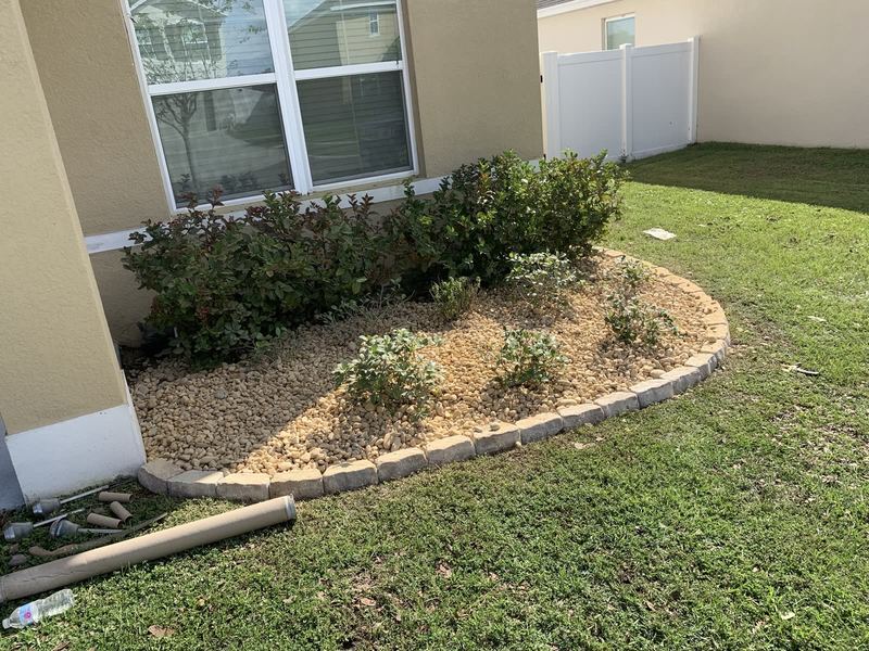 Install in progress — soil and mulch staged.